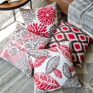 Decorative throw pillow covers with abstract floral and geometric prints for modern sofa room.