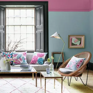 Cozy living room scene showcasing abstract floral and geometric print cushion cover details.