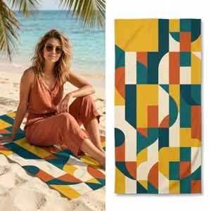 Detail shot of the abstract geometric pattern beach towel, showing soft microfiber texture.
