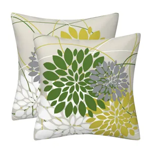 Detailed shot of modern geometric floral throw pillow covers, botanical leaf pattern, cozy home decor.