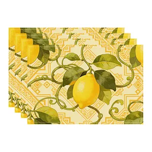 Detailed view of yellow lemon pattern placemats, linen texture, elegant table decor style.
