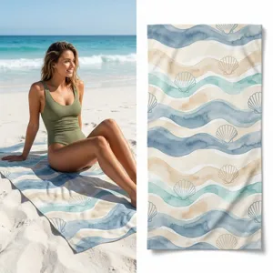 Quick-drying beach towel featuring a watercolor wave and seashell pattern for outdoor sports.