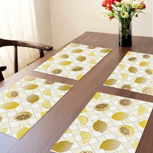 Summer lemon patterned fabric placemat detail, stylish yellow table mat for home dining decor.