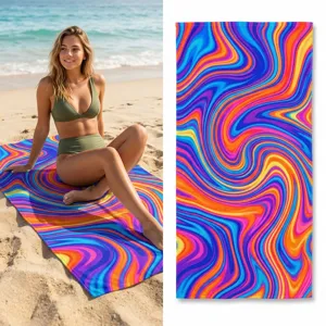 vibrant colorful swirl pattern beach towel detail showing soft texture and ocean beach scene