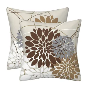 Close up of decorative throw pillow cover with modern geometric floral pattern in brown grey white.