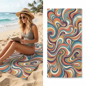Detailed view of abstract retro wavy beach towel showing vibrant multicolor patterns on sand.