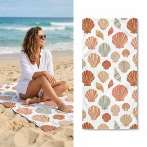 Detailed view of boho seashell pattern beach towel, lightweight and quick dry fabric.
