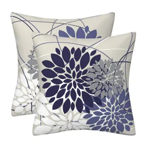 Detailed view of modern geometric floral throw pillow covers, elegant navy and grey design for sofa.