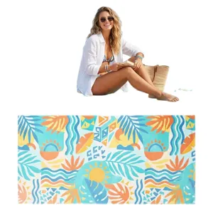 Quick-dry microfiber beach towel with vibrant tropical sun and leaf pattern for summer outdoor.