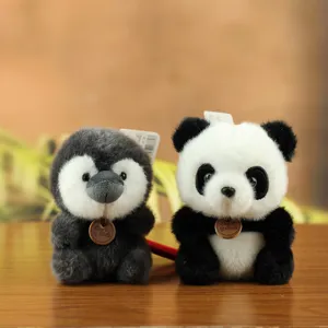 Cute plush panda and penguin toy detail, soft stuffed animal doll pendant for bag and key.