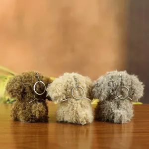 Fluffy dog plush keychain detail, cute puppy bag charm, soft stuffed animal pendant gift.