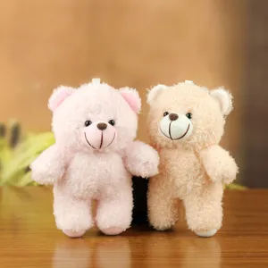 Cute plush bear plushie detail shot showing soft texture, hanging charm and cute facial features.