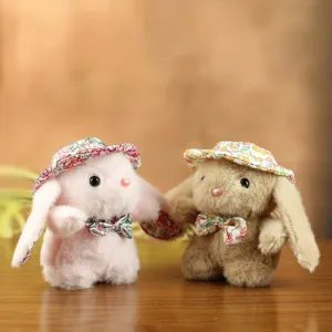 Simpatico coniglio peluche cappello floreale dettaglio portachiavi, borsa decorazione.