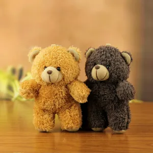 Plush bear keychain detailed view, cute stuffed animal pendant for bags and keys decoration.
