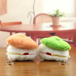 Detailed view of cute plush bread pastry keychain, soft fabric texture with metal ring for bag.