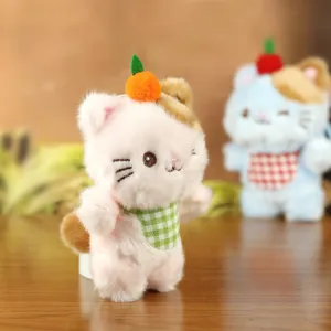 Cute cat plush toy pendant with orange hat and green checkered bib, perfect for bag decoration.