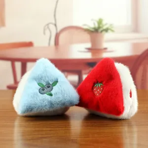 Cute fruit plush toy detail view featuring soft blueberry and strawberry embroidered triangle charms.