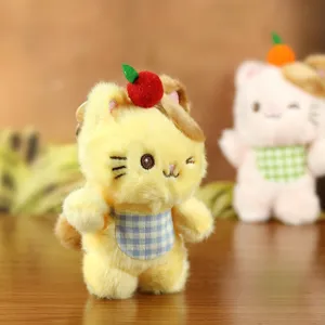 Cute yellow cat plush toy keychain with fruit hat and blue plaid bib for bags and keys ornament