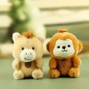 Detailed view of cute plush toys, soft cartoon animal dolls with mini leather tags for desk decor.