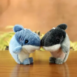 Cute plush shark keychain detail shot, soft fabric and adorable mini design for bag pendants.