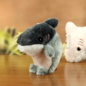 Cute shark seal plush toy keychain detail shot, soft stuffed animal bag charm pendant.