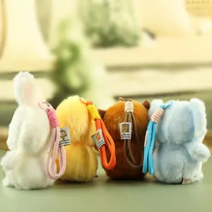Detailed view of cute plush animal keychains, including rabbit and elephant designs.