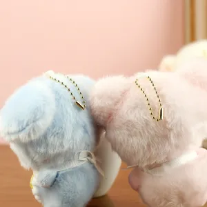 Soft plush bear toy detail showing cute blue and pink stuffed animals with bows.
