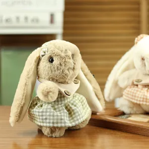Cute plush rabbit doll detail shot, featuring a sweet checkered dress and wooden button collar.