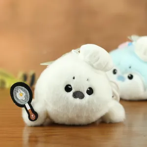 Cute chef sea otter plush toy pendant detail, soft stuffed seal doll bag charm keychain.