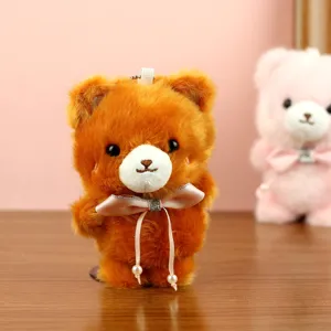 Lindo llavero de oso de peluche marrón con lazo y colgante de perlas para decoración de bolsos.