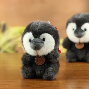 Cute mini plush penguin toy doll detail view, soft stuffed animal keychain pendant decor.