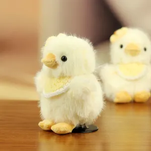 Lindo colgante de juguete de pollito amarillo de felpa con babero y flor, muy suave.
