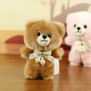 Cute brown teddy bear plush pendant with pearl bow, fluffy bag charm and key chain toy.