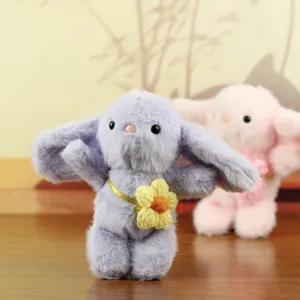 Cute purple plush rabbit pendant toy with yellow flower charm, soft stuffed animal keychain.