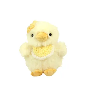 Lindo juguete de peluche pollito pato amarillo con babero de flor llavero colgante bolso