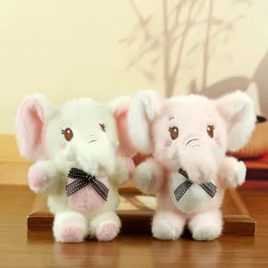 Cute plush elephant toy detail, soft stuffed animal pendant, lovely pink and white doll decor.