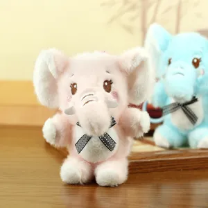 Cute plush elephant toy detail shot, soft stuffed animal doll with bow for bag charm.
