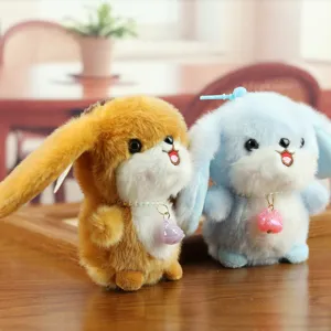 Cute plush rabbit keychain with pearl necklace detail, soft toy pendant close-up view