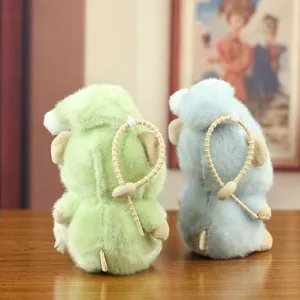Cute pajama bear plush toy pendant, soft fluffy keychain charm in green and blue colors.