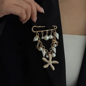 Gold-toned safety pin brooch with pearl shell starfish tassels chic fashion apparel accessory