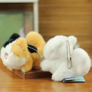 Detailed close-up of cute plush cat keychain plushies with metal ball chains, soft and fluffy.