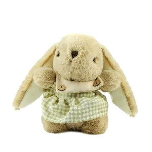 Cute plush rabbit toy with long floppy ears and green checkered dress, soft stuffed doll.
