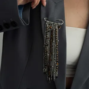 European and American style metal safety pin brooch with multi-layer chains and beads.