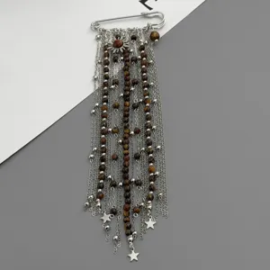 Vintage multi-strand tassel brooch safety pin with natural tiger eye beads and star charms.