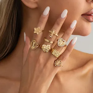 Gold ring set multi-piece vintage irregular heart cross rings detail closeup fashion jewelry