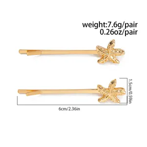 Gold starfish hair clip detail view, alloy bobby pin with beach ocean style design, 6cm.