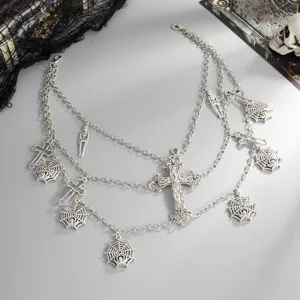 Gothic multi-layer waist chain with crosses and spider webs, vintage silver body jewelry for women.