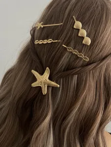 Golden ocean style hair clip set with starfish and seashell designs for women beach fashion wear