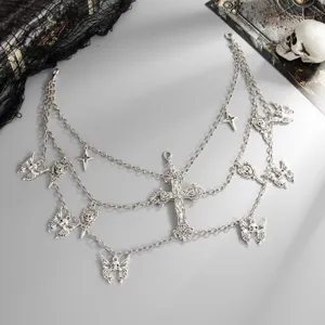Gothic silver layered waist chain with cross and skull pendants, perfect for Halloween.