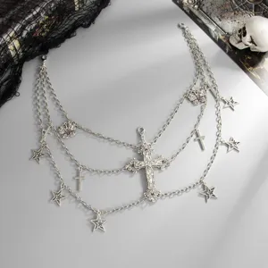 Gothic multi-layer waist chain featuring crosses, stars, and butterfly charms in silver.